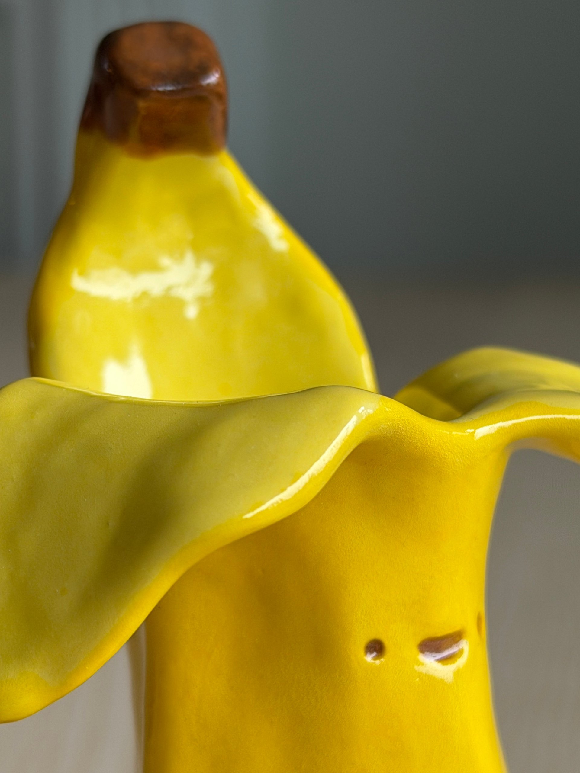Both banana cups together, one standing behind the other