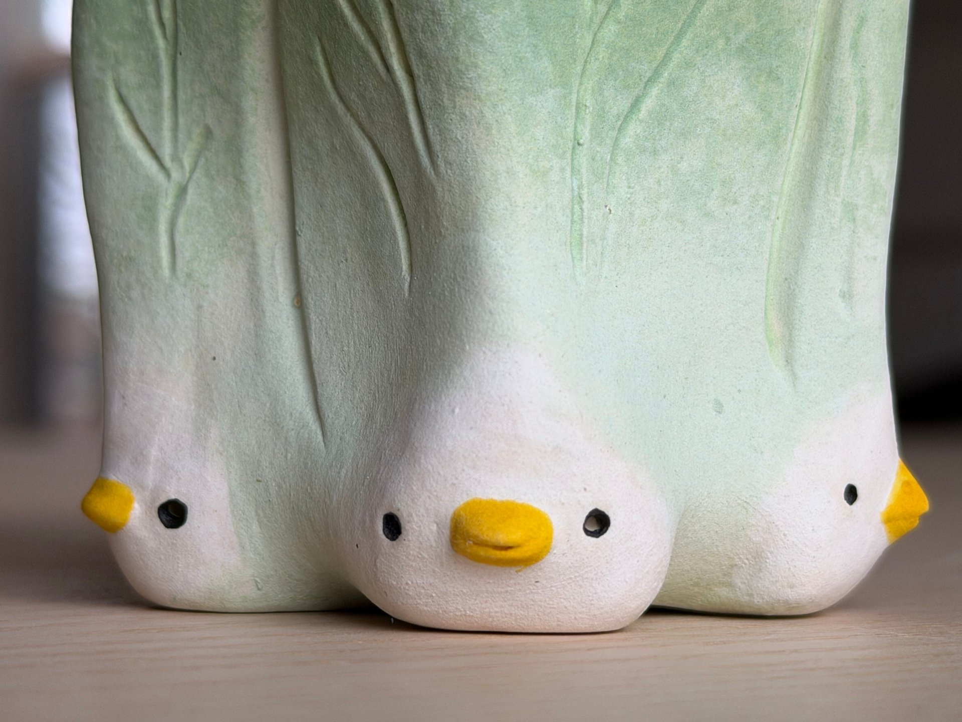 The three chickens seen straight on