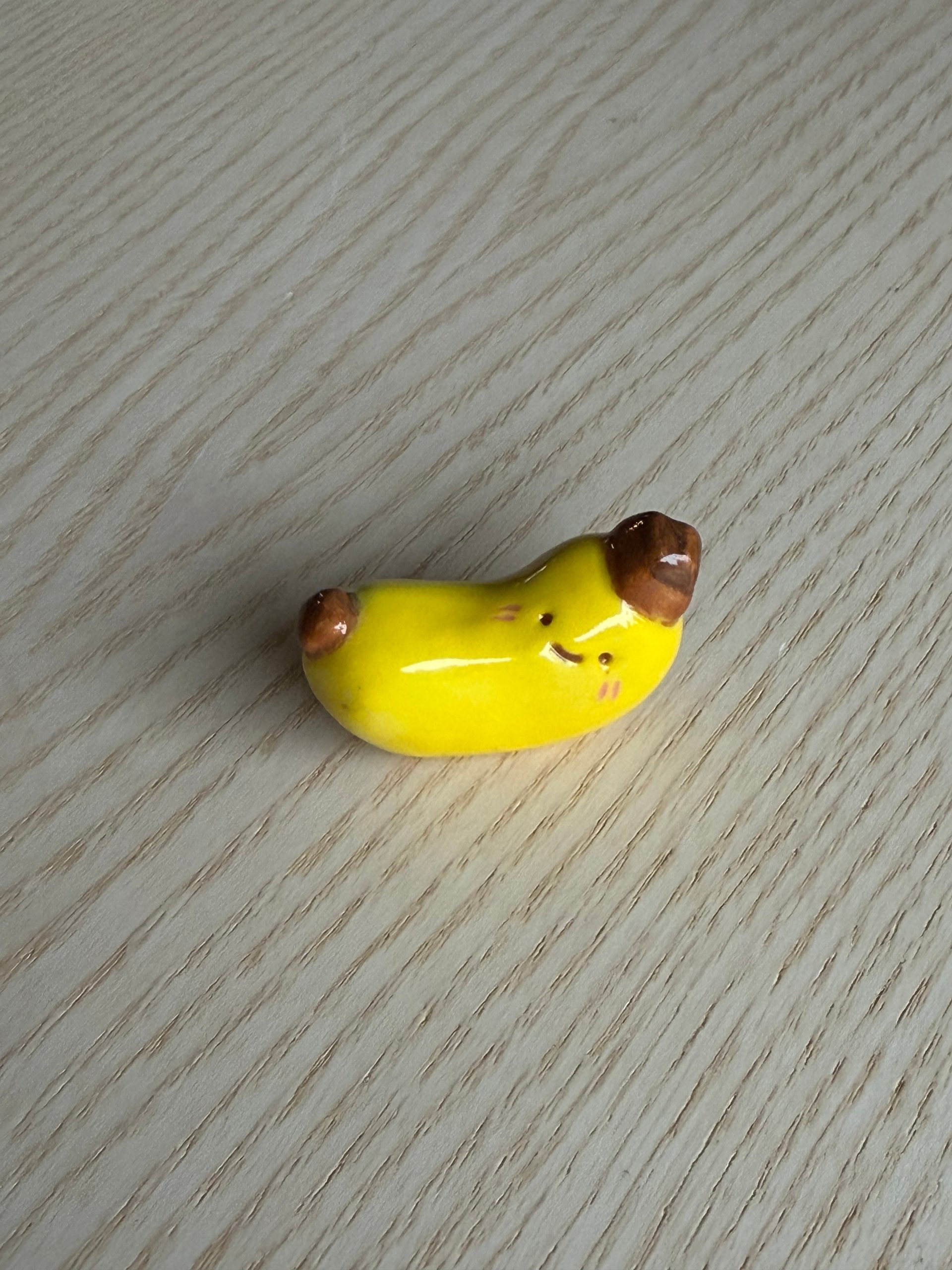 The yellow bean beside the brown one