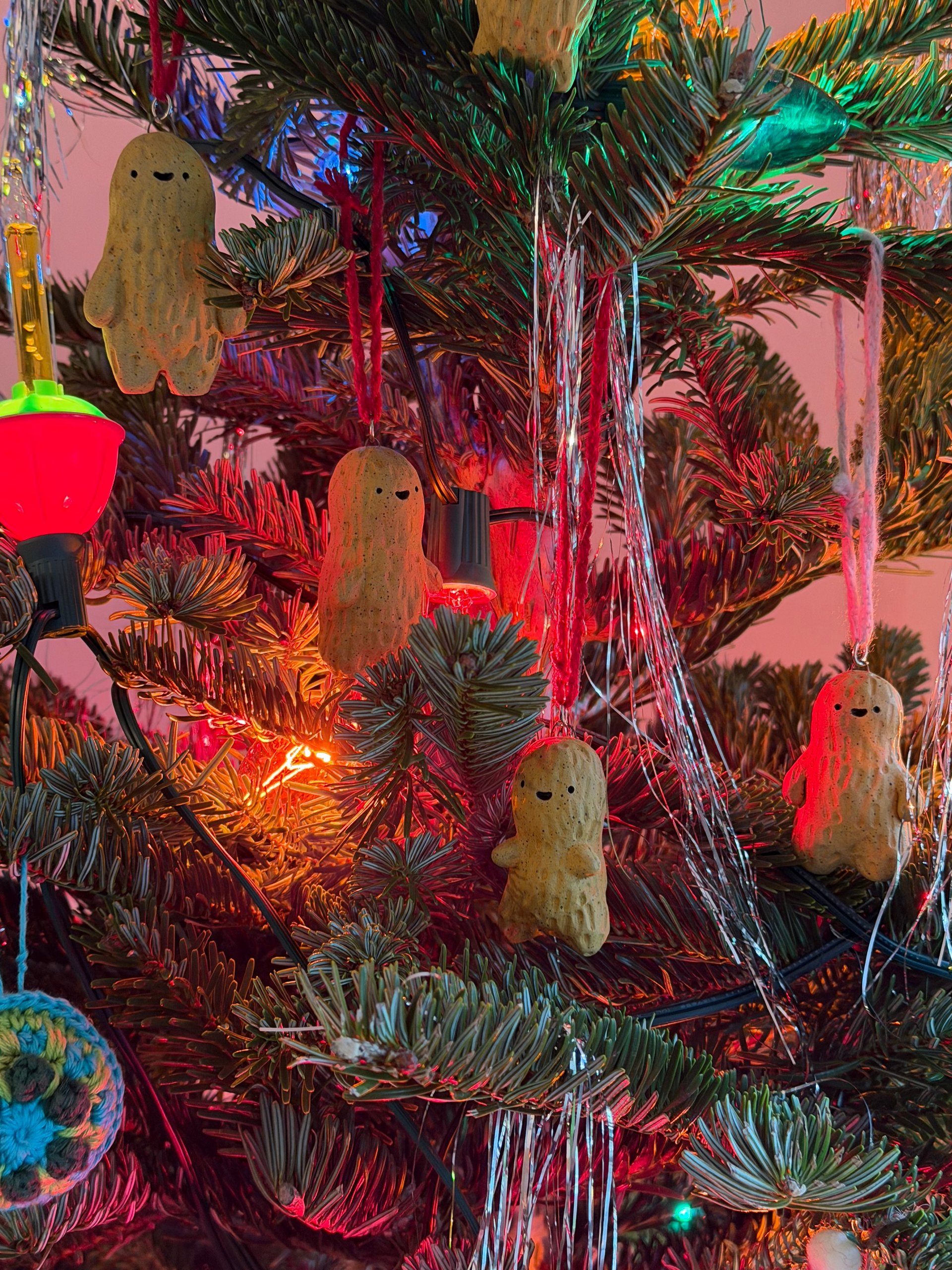 The whole tree, peanuts scattered through the branches among the tinsel